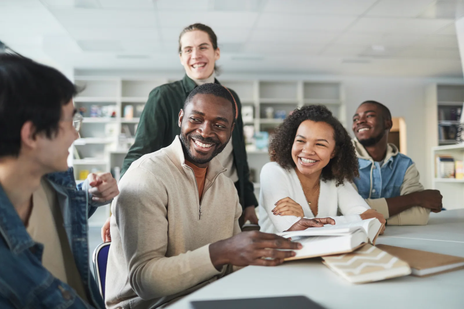 Adult learners reading together in a workplace learning session